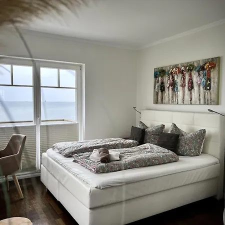 Ferienhaus-sliminde-by-seeblick-ferien-direkte-wasserlage-e-ladesaeule-sauna *