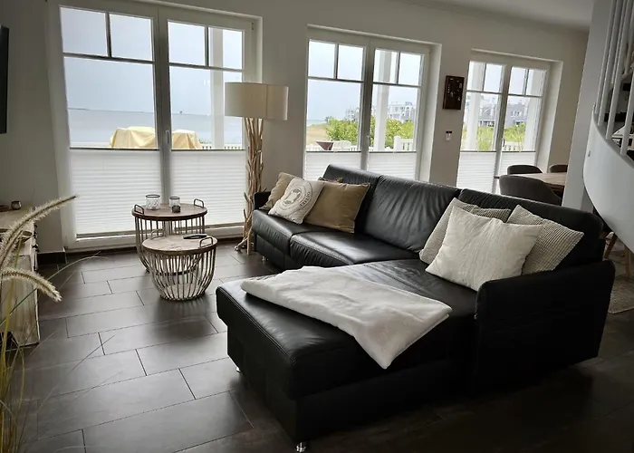 Ferienhaus-sliminde-by-seeblick-ferien-direkte-wasserlage-e-ladesaeule-sauna *